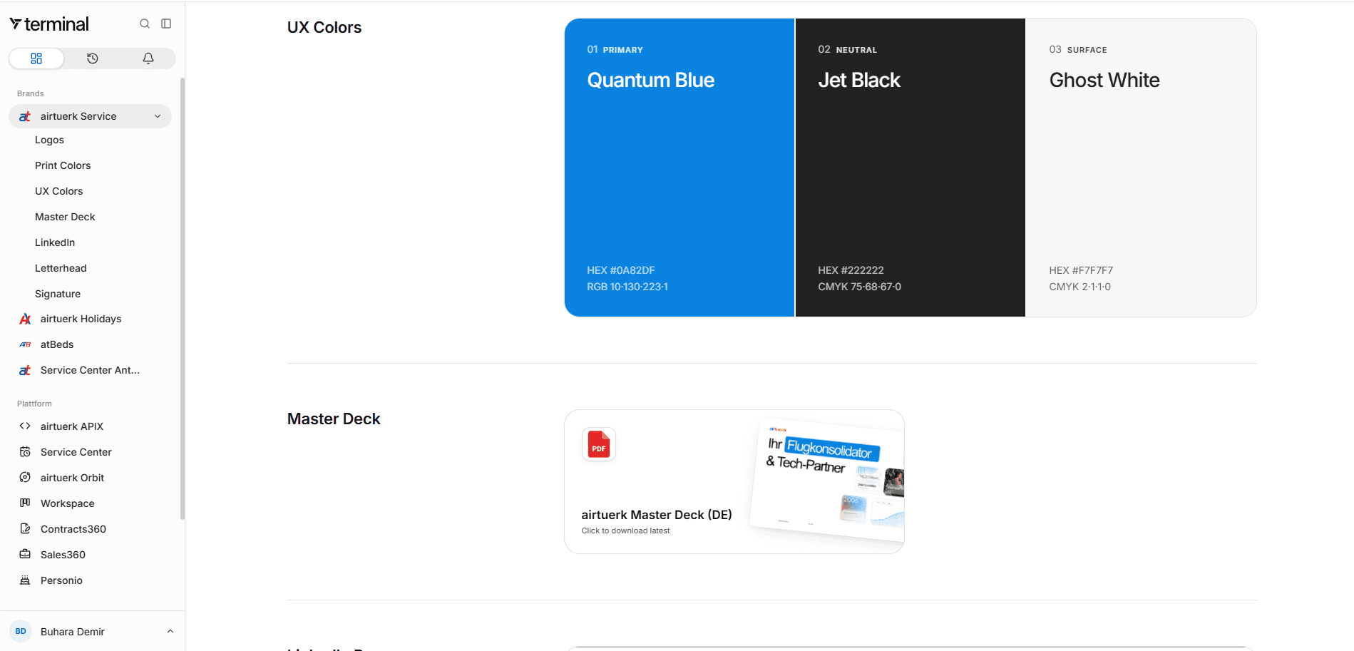 The UX colour definitions inside terminal showing Quantum Blue, Jet Black and Ghost White with hex and CMYK values, alongside the downloadable master deck